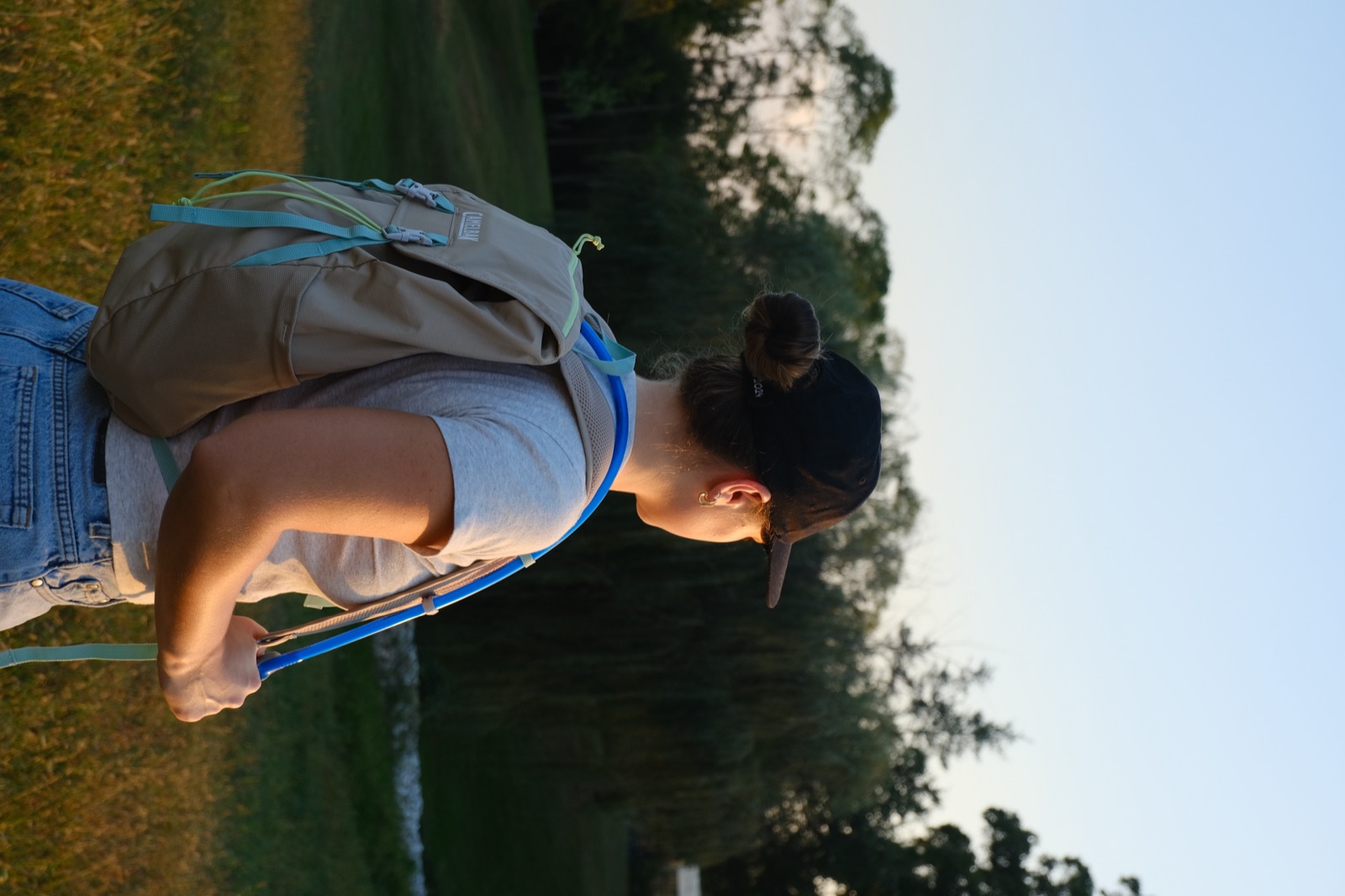 Emma wearing the Take Off backpack